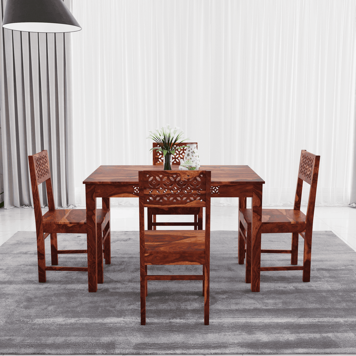 Wooden dining table set with four chairs side view