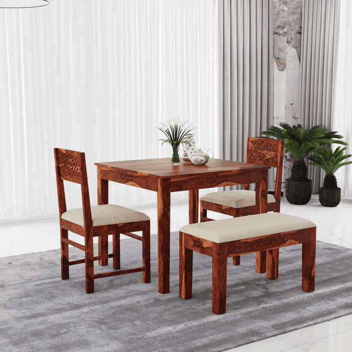 4 seater dining table with two chairs and one bench made of solid sheesham wood