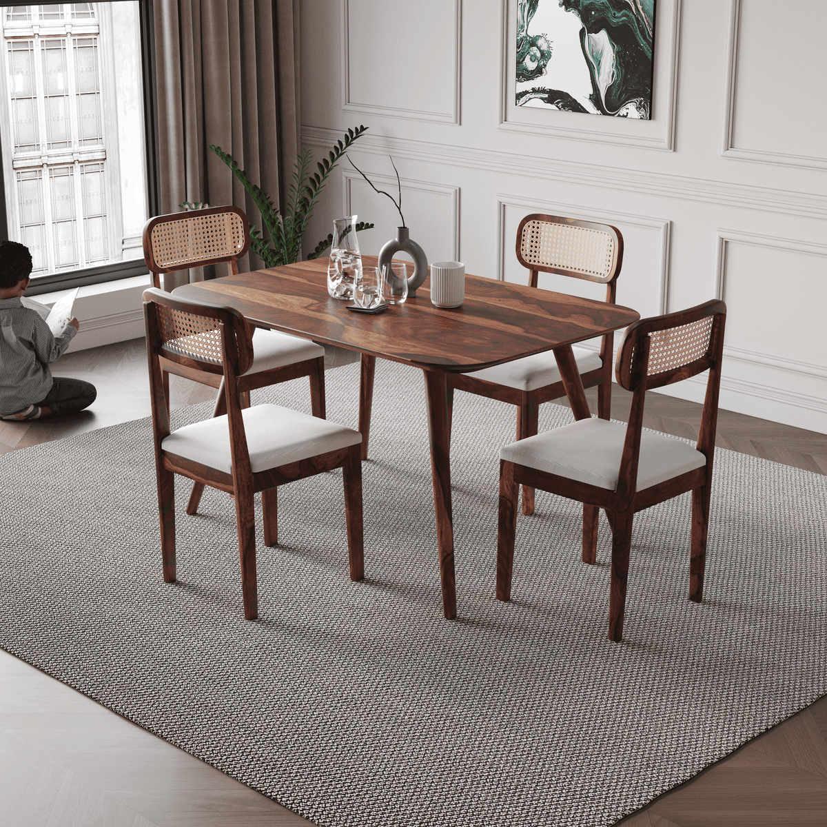 Dining room with wooden table and chairs on a gray rug