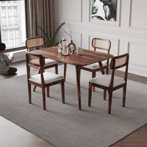 Dining room with wooden table and chairs on a gray rug