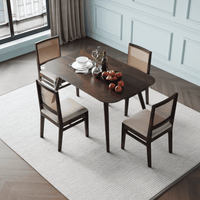 Dining table set with four chairs in a room side top view