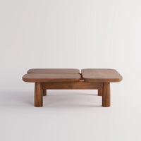 A mid-century modern wooden low table with three rounded rectangular top sections supported by four short block legs, shown on a light gray studio background.