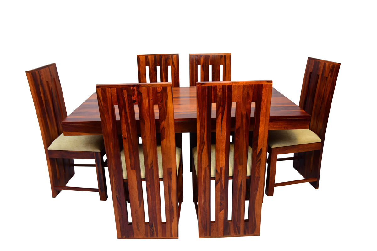 Wooden dining table set with six chairs on a white background
