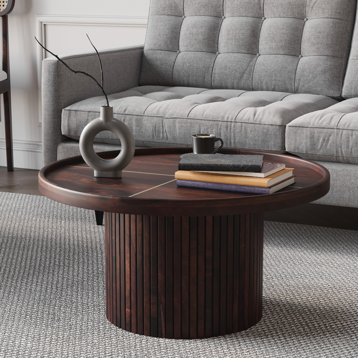 Wooden coffee table with decorative items in a living room setting
