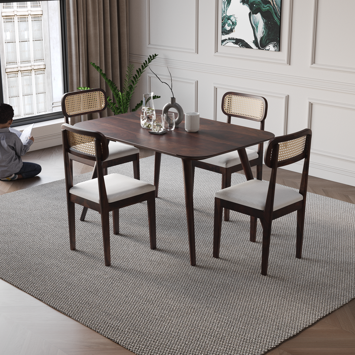 Dining room with wooden table and chairs on a gray rug