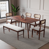 Dining room set with wooden table and chairs on a gray rug.