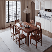 Dining area with wooden table and chairs in a modern kitchen.