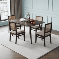 Dining table set with four chairs in a room main view