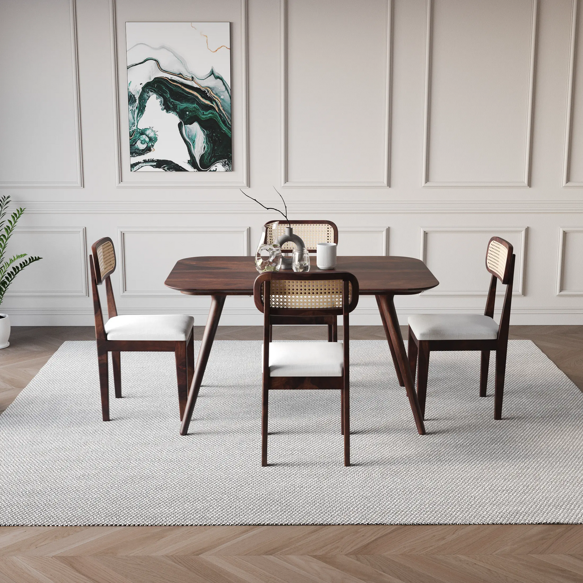 Dining room with wooden table and chairs in a modern interior setting.