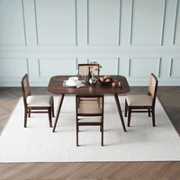 Dining table set with chairs in a room with side view