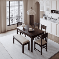 Dining area with wooden table and chairs in a modern kitchen setting.