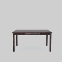 Wooden table with decorative cutout design on a light gray background