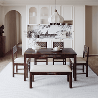 Dining room with wooden table and chairs in a modern interior setting.