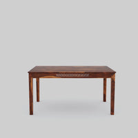 Wooden table with intricate carvings on a gray background